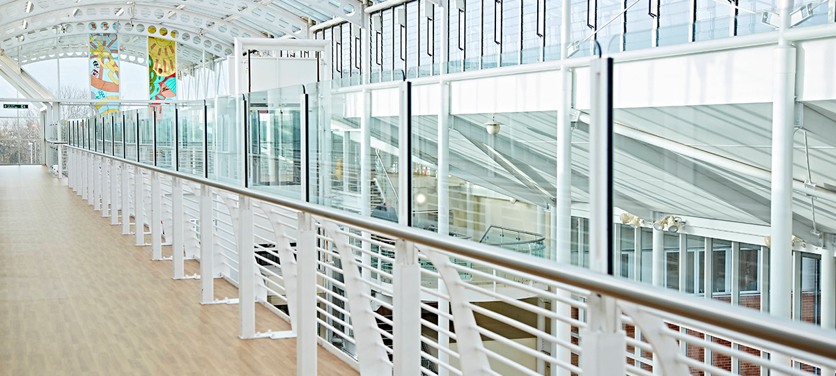 Shot of glass windows and walkway in hospital