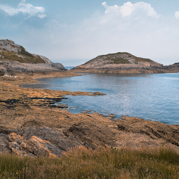 Sandy beach with sea in the background 