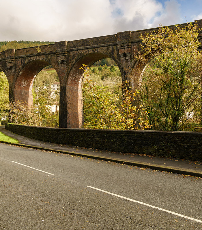 Image of road with bridge in background 