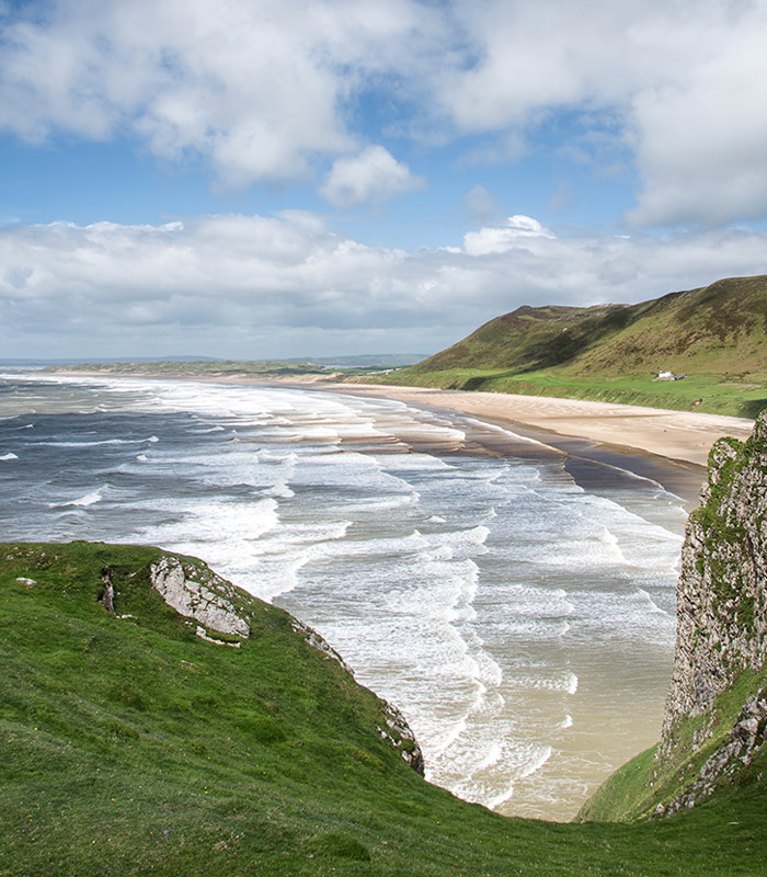 Panoramic view of the beach with hills in the background 