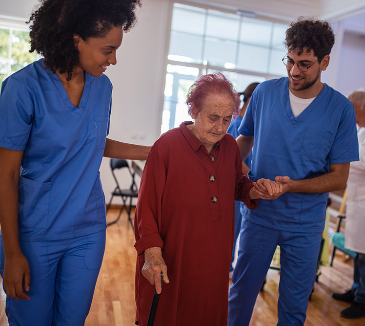 Two Clinical Staff Members Elderly Woman